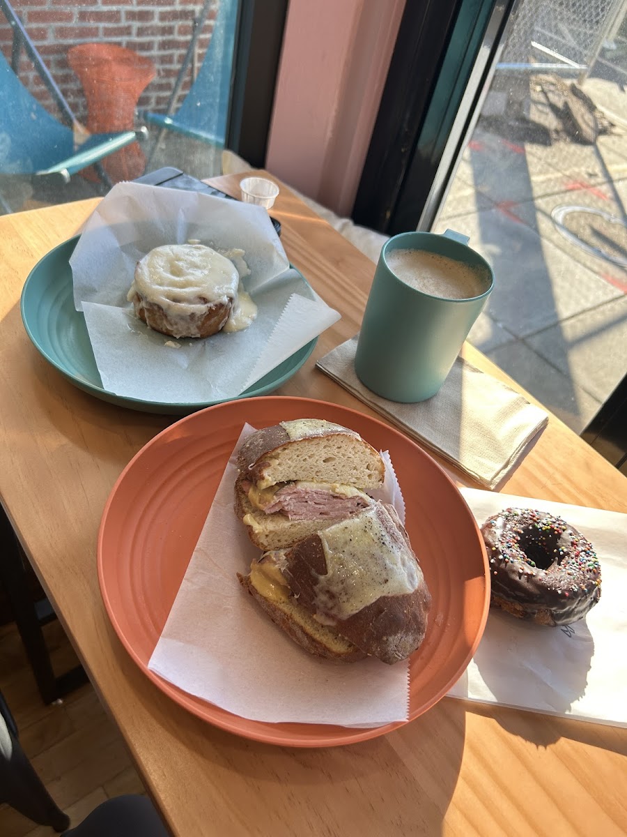Ham and Gruyère sandwich, chocolate donut, and cinnamon roll
