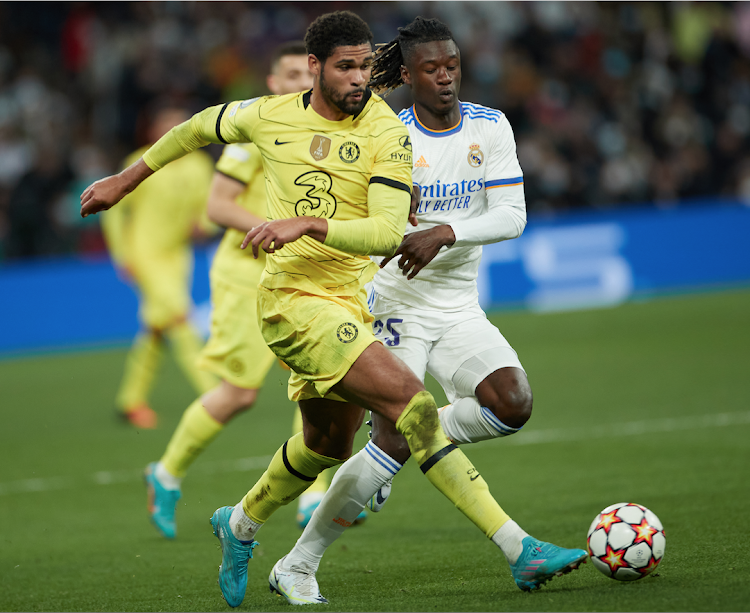 Real Madrid Eduardo Camavinga (R) vies for the ball with Ruben Loftus-Cheek of Chelsea during a Uefa Champions League quarterfinal second leg match at Santiago Bernabeu Stadium on April 12, 2022