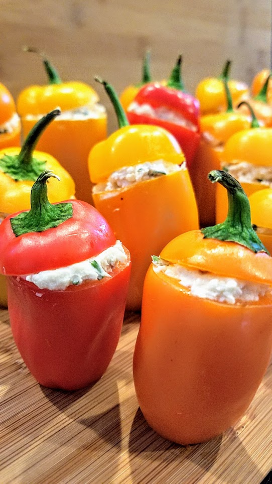 Recipe for Cheese Stuffed Mini Peppers, easy peasy and are adorable because of the way you can get multiple colors with the orange, yellow and red which are so cheerful, and then presentation wise the way they stand up in little rows or formations so bravely