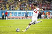 CALM:   Michael Umana of Costa Rica shoots and scores the winning  penalty against  Greece Photo: Ian Walton/Getty Images