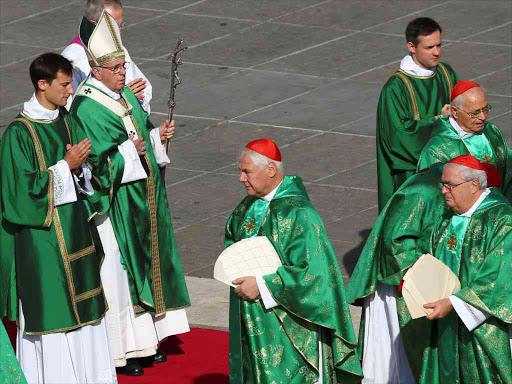 Pope Francis arrives during a Marian vigil mass in Saint Peter's square at the Vatican, October 9, 2016. /REUTERS