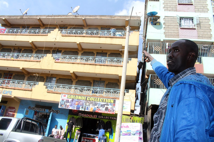 Haila Asanake's cousin Branu Boku shows where he was shot dead by a stray bullet at Kiamaiko area during an interview on September 13, 2021