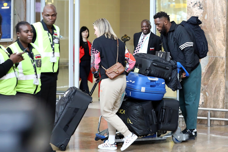 Siya Kolisi and his wife Rachel at OR Tambo International Airport.