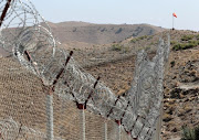 A view of the border fence outside the Kitton outpost on the border with Afghanistan in North Waziristan, Pakistan October 18, 2017.