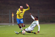 Khuliso Mudau of Mamelodi Sundowns and Nqobeko Dlamini of Golden Arrows players during the DStv Premiership match at Tuks Stadium on September 10.