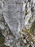 The climbers dangling on ropes as seen from the Skymed rescue helicopter. 