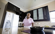 Domestic worker, Linah Mphuthi in one of the houses she cleans for a living.