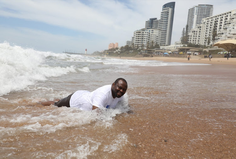 Dr Musa Gumede, eThekwini deputy city manager, enjoyed a swim at Umhlanga main beach to prove it was safe in December. The beach reopened on Tuesday after high E coli levels forced its closure last week. File photo.