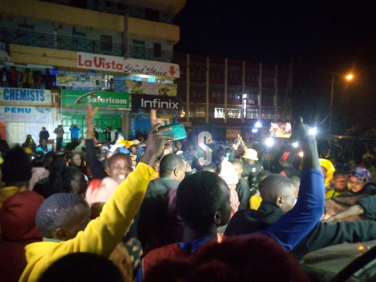 Residents of Embu County waving torches in celebration on August 15,2022.