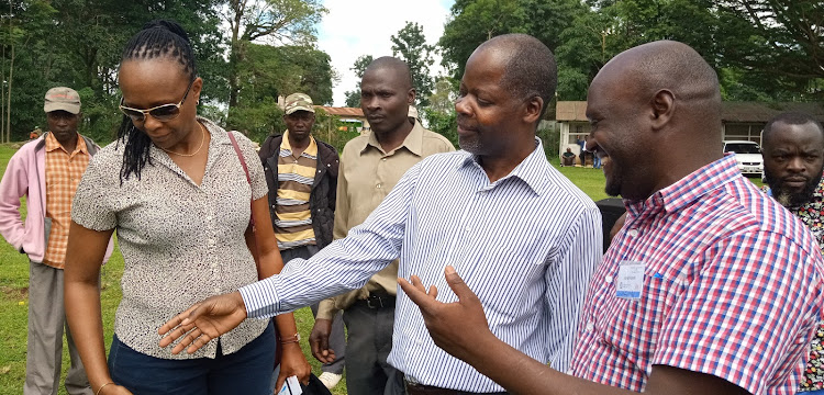 IREN director James Shikwati (C) with Veni Swai of Nauman Foundation during the annual Bukura trade and cultural exhibitions at Golf hotel in Kakamega