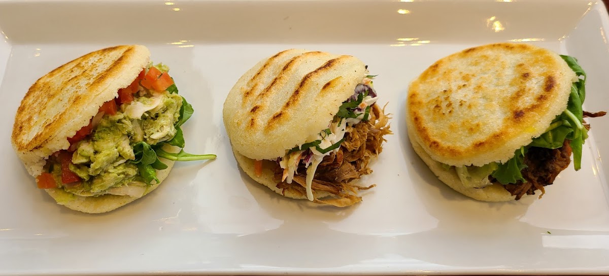 Try Arepas, these are the quintescential food item for Venezuelan menu