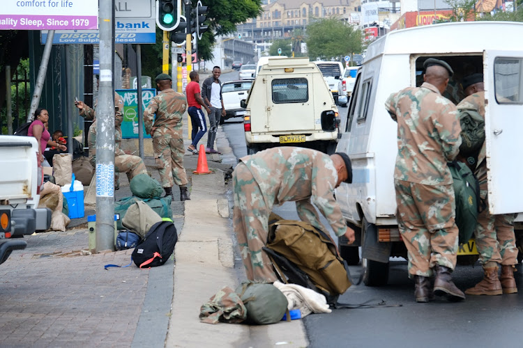 SA National Defence Force (SANDF) members arrive at Rand Light Infantry in Johannesburg on March 23 2020.