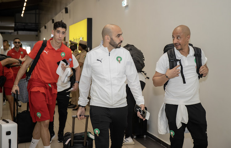 Morocco coach Walid Regragui, middle, arrives in Ivory Coast with the team for the 2023 Africa Cup of Nations at the San Pédro Airport.