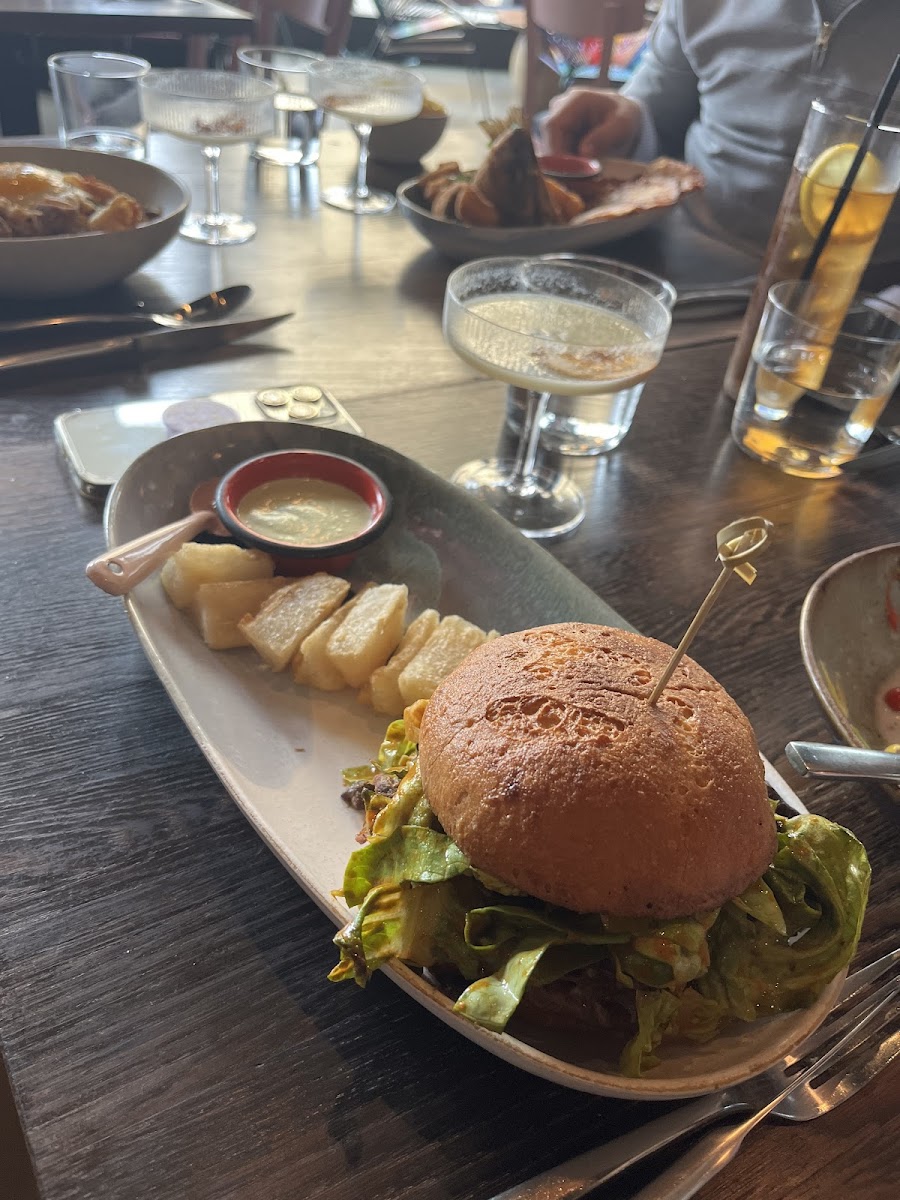 Shredded pork shoulder on GF bun with Yuki fries.