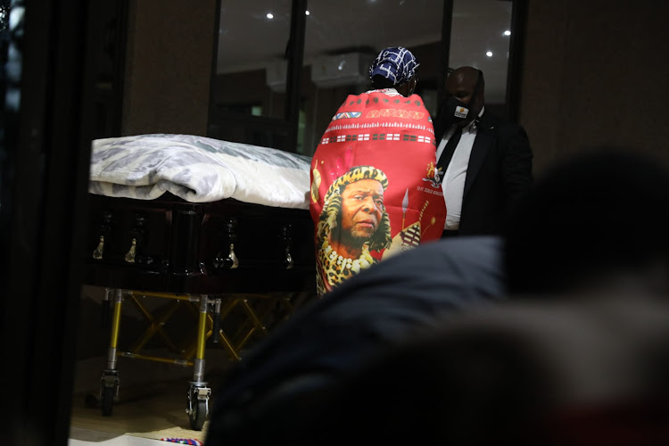 Mourners gather around the Queen's casket ahead of her private burial.