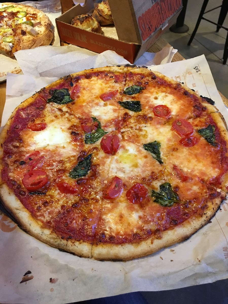 Looks delish, however they do not understand cross contamination.  After carefully walking it down the line the cook used the same cutter to slice my gf pizza 🍕 😦 But they made it again 😉