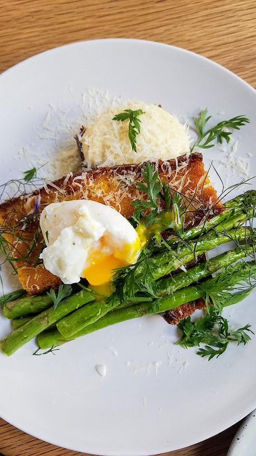 Asparagus and Parmesan Pudding with grilled asparagus, soft parmesan pudding, grilled corn bread, poached free-range egg from Brunch at Proud Mary Coffee in Portland, at 2012 NE Alberta St