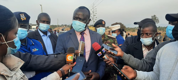 Machakos county commissioner John Ondego addressing reporters at the scene where two people died after their vehicle was sprayed with bullets along Nairobi- Machakos road at Kathome area in Machakos County on Friday, July 30.