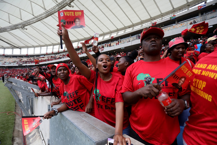 Supporters of the EFF sing during the party's manifesto launch at Moses Mabhida stadium in Durban on Saturday.