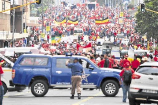 UP IN ARMS: Cosatu members and others marched in Johannesburg in March 2012, calling for stopping the implementation of the e-tolling system. PHOTO MOHAU MOFOKENG