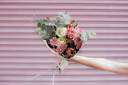 Petal&Post's posies are wrapped in white kraft paper and tied with ribbon.