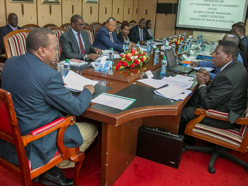 President Uhuru Kenyatta at a meeting with Water and Irrigation ministry offi cials at Harambee House on November 14 /PSCU