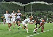 Marika Koroibete of the Melbourne Rebels dives over to score his try during a Super Rugby match against the Waikato Chiefs in Melbourne on Friday 17 February 2017. The Chiefs won 27-14.