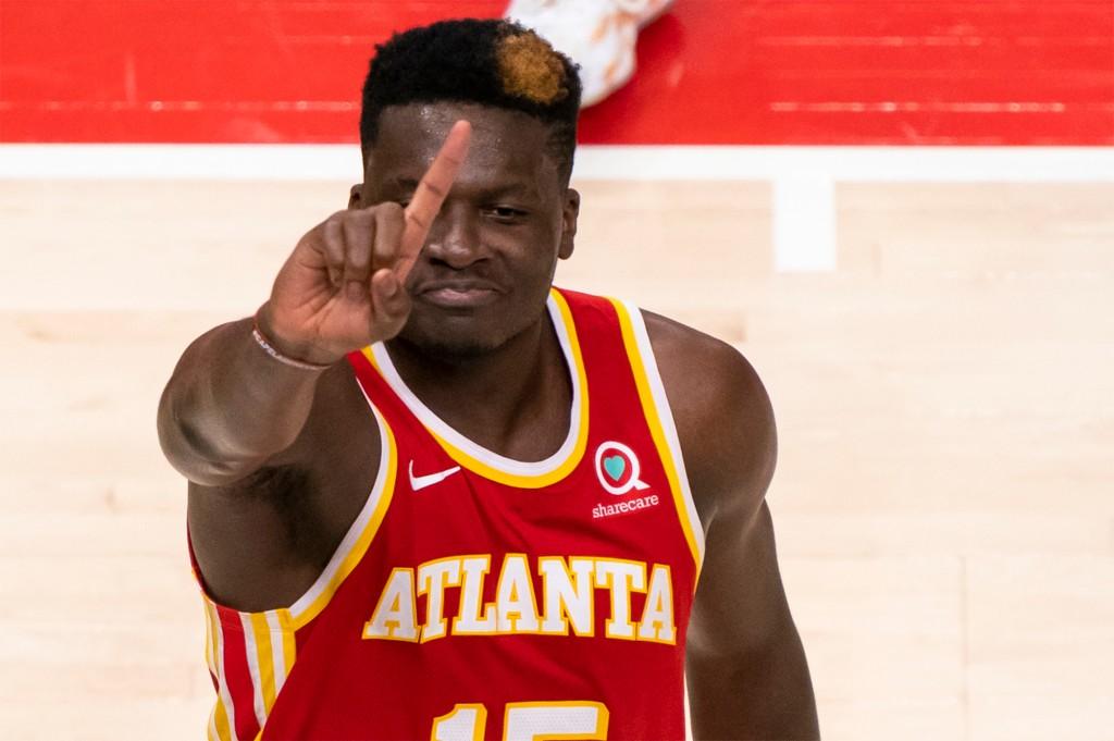 Hawks center Clint Capela wags his finger after blocking Knicks star Julius Randle during Friday's game.