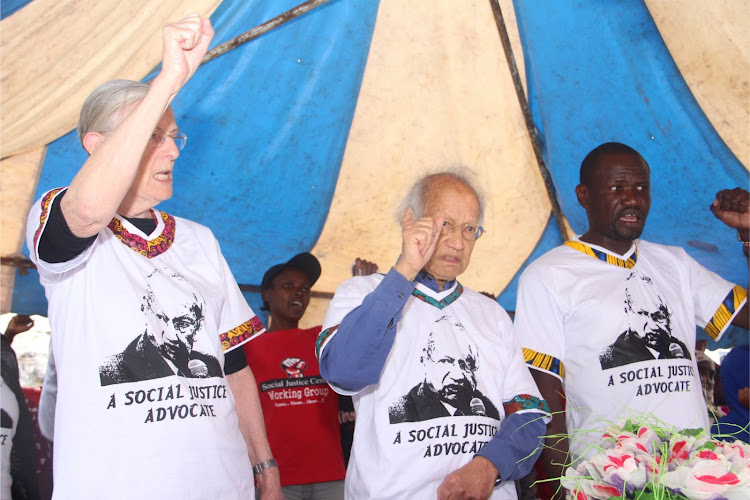 Jill Ghai, Yash Pal Ghai and Wilfred Olal sing the comrades anthem