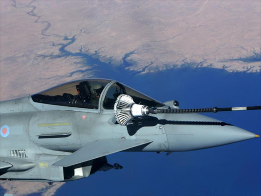 British Royal Air Force Typhoon aircraft refuel from a tanker aircraft during a mission over central Iraq September 21, 2016. /REUTERS