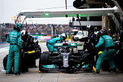 Lewis Hamilton pits for fresh intermediate tyres during the final stages of the F1 Grand Prix of Turkey at Intercity Istanbul Park on October 10 2021.