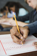 A student writing an exam.