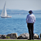 Item logo image for Men looking at boats