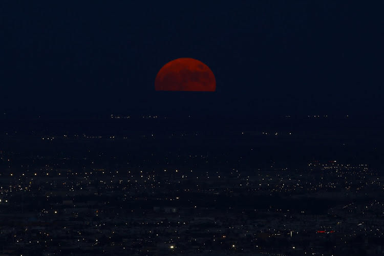 A super moon, known as the Blue Moon, rises above Ciudad Juarez, Mexico August 30, 2023.