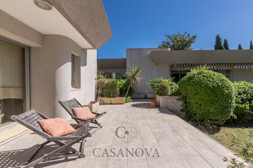 Tiled terrace with two lounge chairs in this luxury house for sale in Montferrier-sur-Lez ($1,045,701 - 210 m²)
