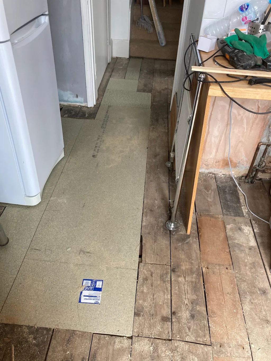Repair flooring and lay new laminate 