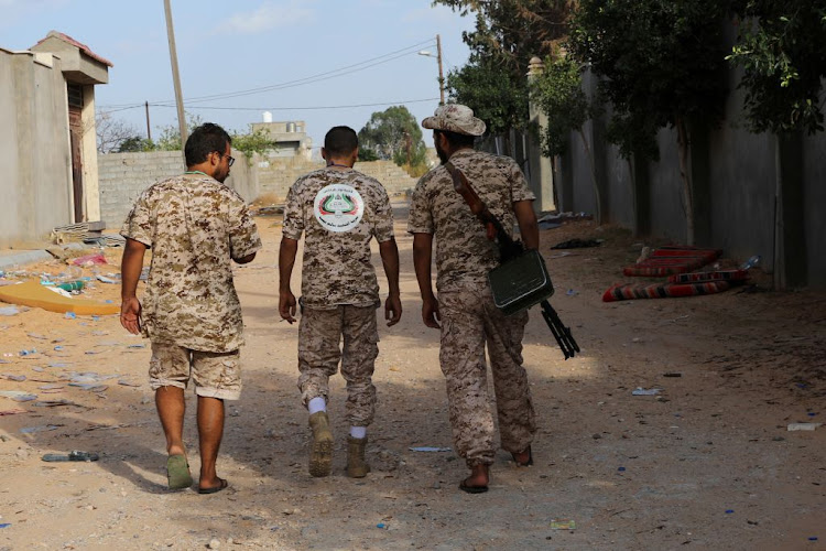 Members of the Libyan internationally recognised government forces carry weapons in Ain Zara, Tripoli, Libya, on October 14 2019.