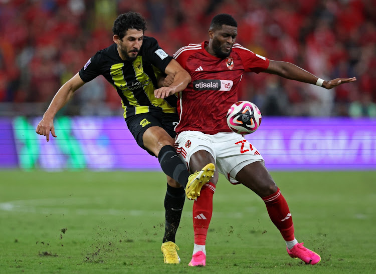 Al Ahly's Anthony Modeste in action with Al Ittihad's Ahmed Hegazy.