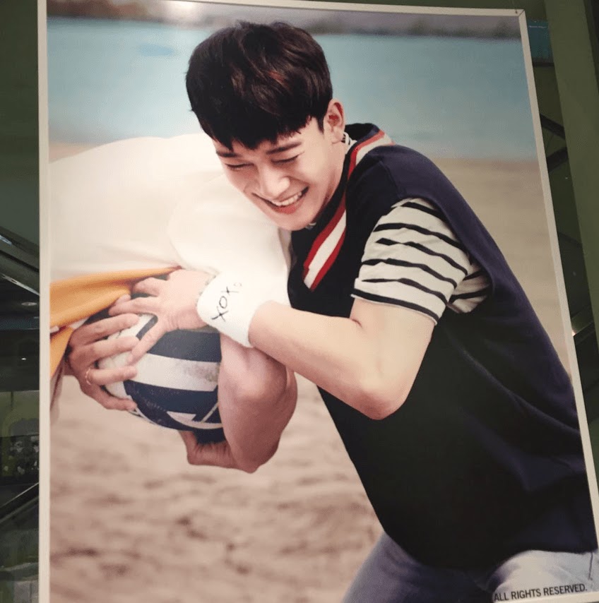 Image: EXO's Chen playfully taking a volleyball from one of the members / SM Entertainment