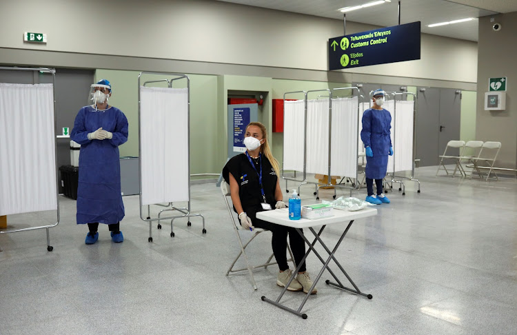 Health Ministry officials prepare to conduct coronavirus disease (COVID-19) tests on passengers from Germany, who were frontline workers during the outbreak of the virus, upon their arrival on a TUI Airways flight at Kos International Airport on the island of Kos, Greece, June 29, 2020.