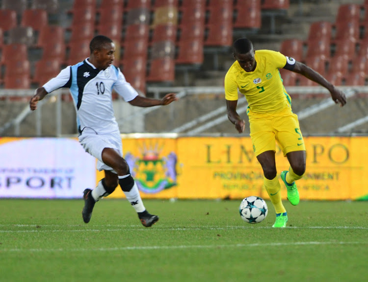 Siyanda Xulu of South Africa and Onkabetse Makgantai of Botswana during the COSAFA Cup Plate Final match between South Africa and Botswana at Peter Mokaba Stadium.