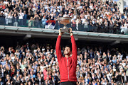 Serbia's Novak Djokovic holds the trophy after winning the men's final match against Britain's Andy Murray at the Roland Garros 2016 French Tennis Open in Paris on June 5, 2016. Picture credits: AFP