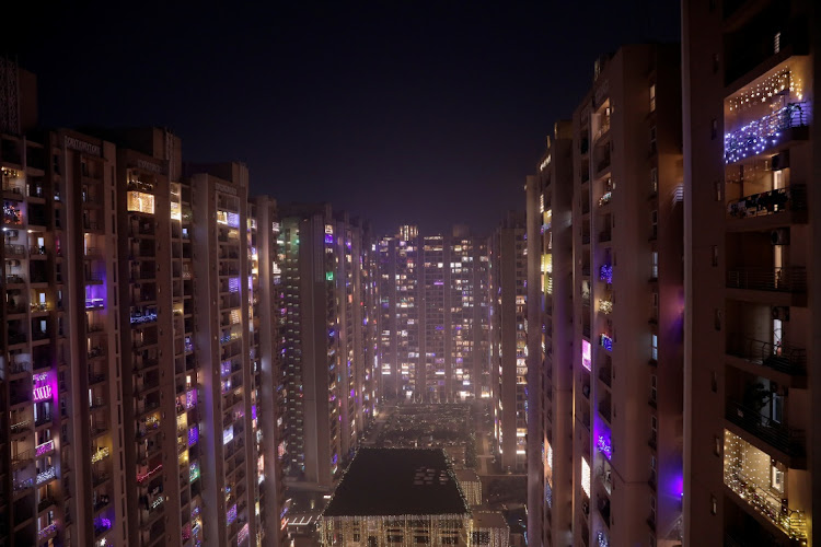 Decorative lights in the balconies of a high-rise during Diwali, the Hindu festival of lights, in Noida, a satellite city of Delhi, on November 4 2021. REUTERS/ANUSHREE FADNAVIS