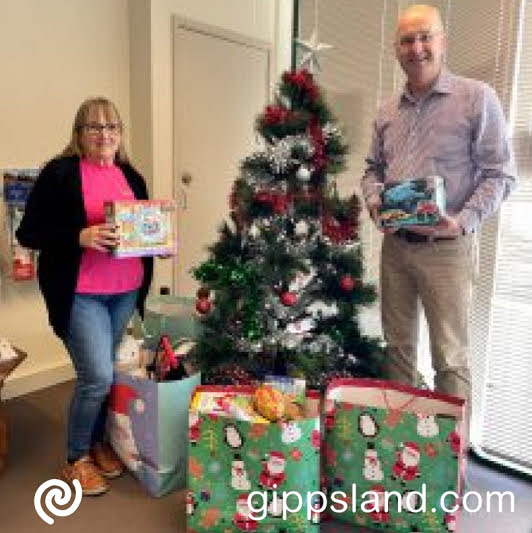 The Nationals Member for Gippsland South Danny OBrien handing over donated gifts to Heather Baird, founder of A Better Life for Foster Kids