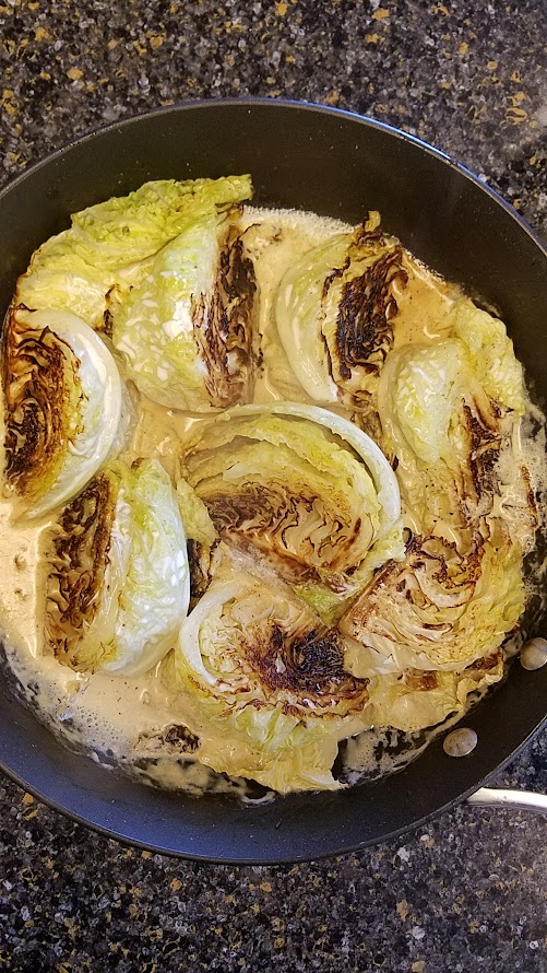 Cabbage with cream in the pan for a Creamed Cabbage Recipe