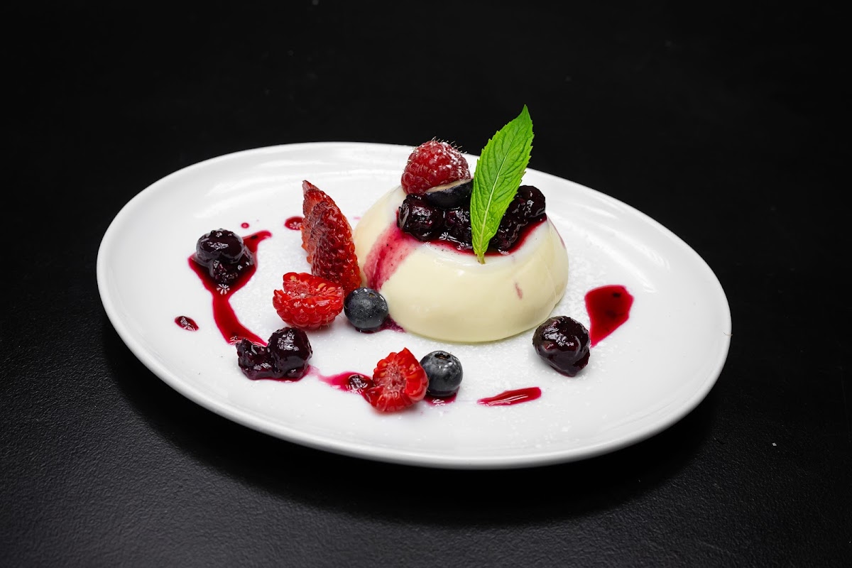 Vanilla bean Pannacotta with berry compote