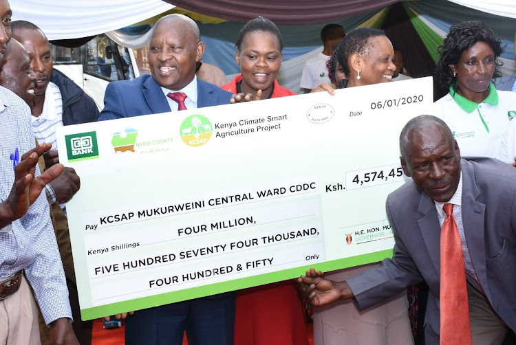 Nyeri Governor Mutahi Kahiga (C) when he presented cheques to groups in January this year