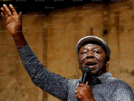 Opposition Movement for Democratic Change leader Morgan Tsvangirai addresses a crowd gathered outside parliament in Harare, Zimbabwe, November 21, 2017. /Reuters