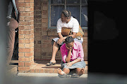 A woman waits anxiously at the Phumula Gardens Primary School in Vosloorus, Ekurhuleni, yesterday for news of pupils and teachers involved in a crash on the way to Durban. The school principal and members of the school governing body were also on the bus Picture: DANIEL BORN