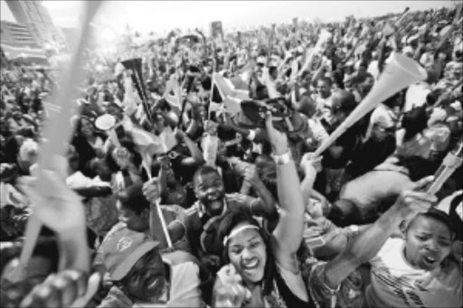 Bafana Bafana fans celebrating a goal by Siphiwe Tshabala in Durban's fan fest in north beach. Pic: TEBOGO LETSIE 11/06/2010. The Times.